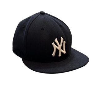 New Era Black Hat with New York Yankees Logo. Size 7 1/2.